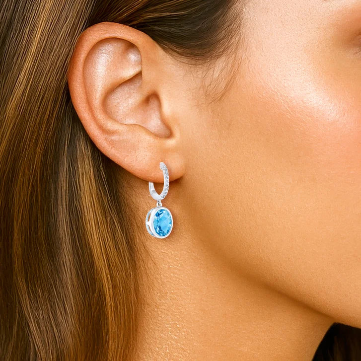 Oval Cut Swiss Blue Topaz and Diamond Earrings (0.16 ctw)
